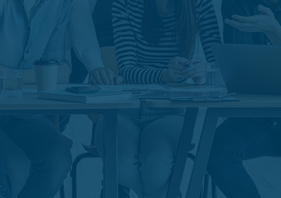 People behind blue background