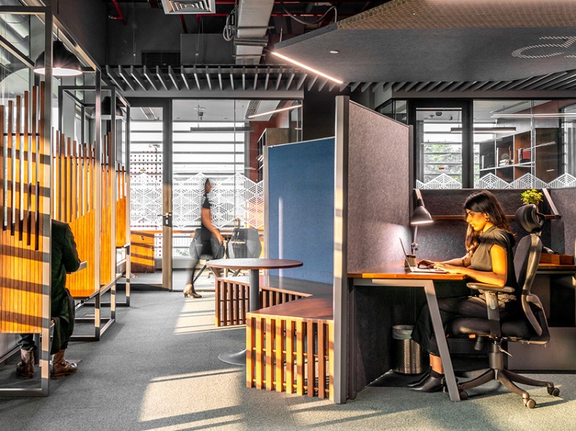 Girl is sitting and doing her work on laptop